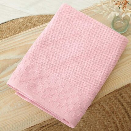 Serviette de bain rose guimauve